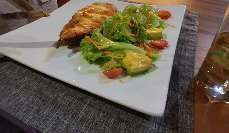 A main course with fresh salad and avocado at Natura Cabana