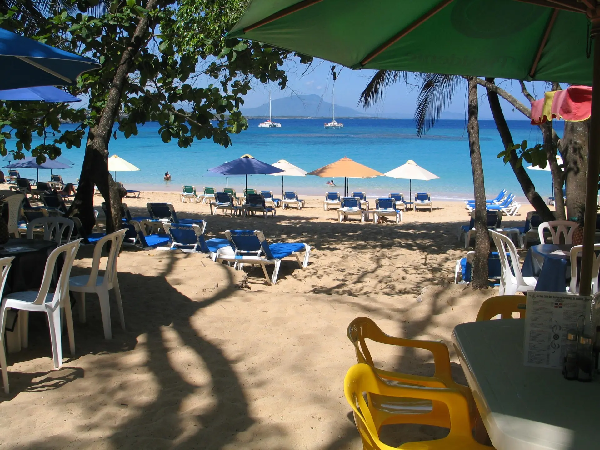 View from a beachfront restaurant terrace looking out over Sosúa bay
