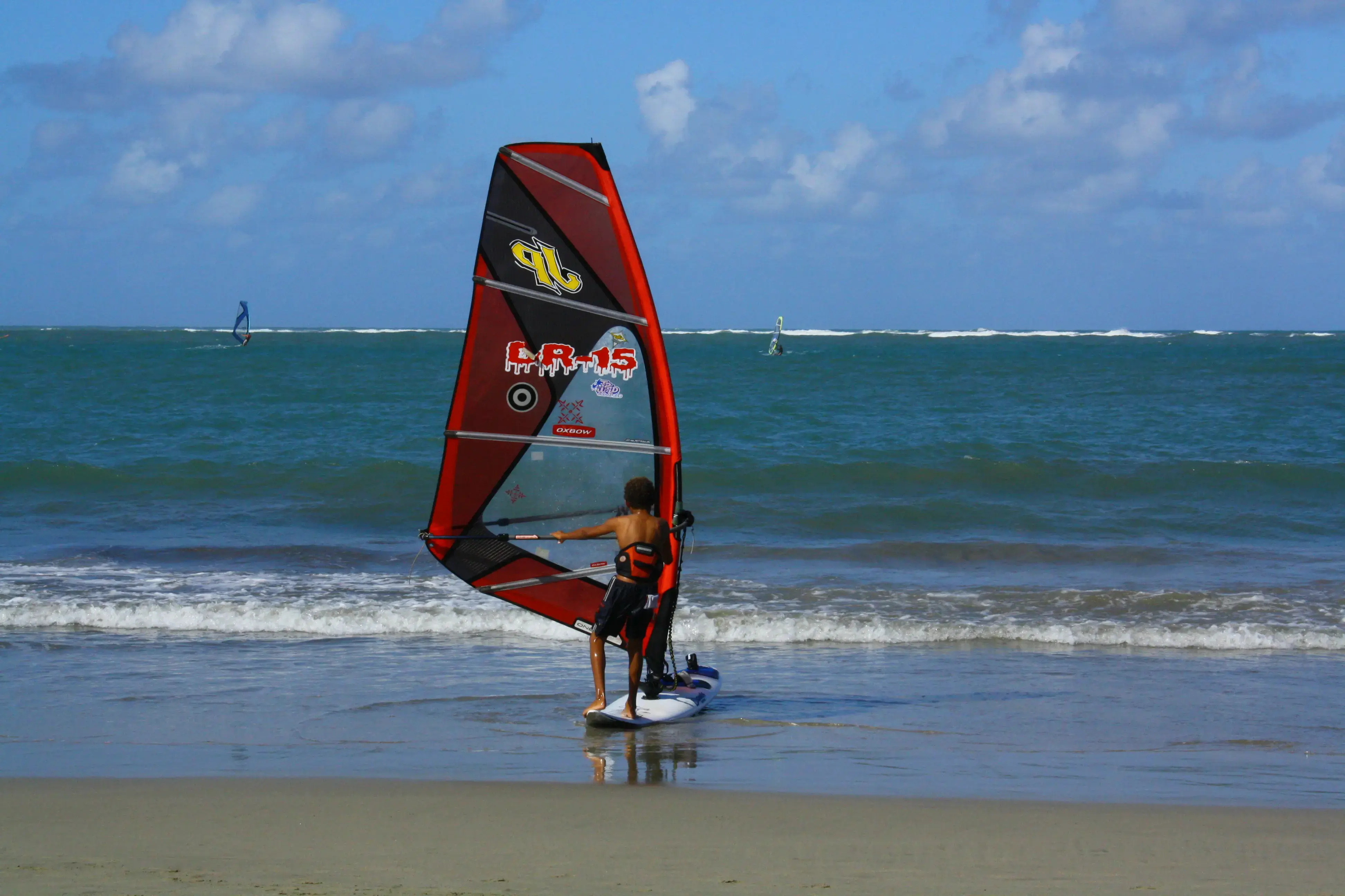 Windsurfer launching from the beach at Cabarete